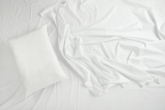 close up of bedding sheets and pillow.jpeg